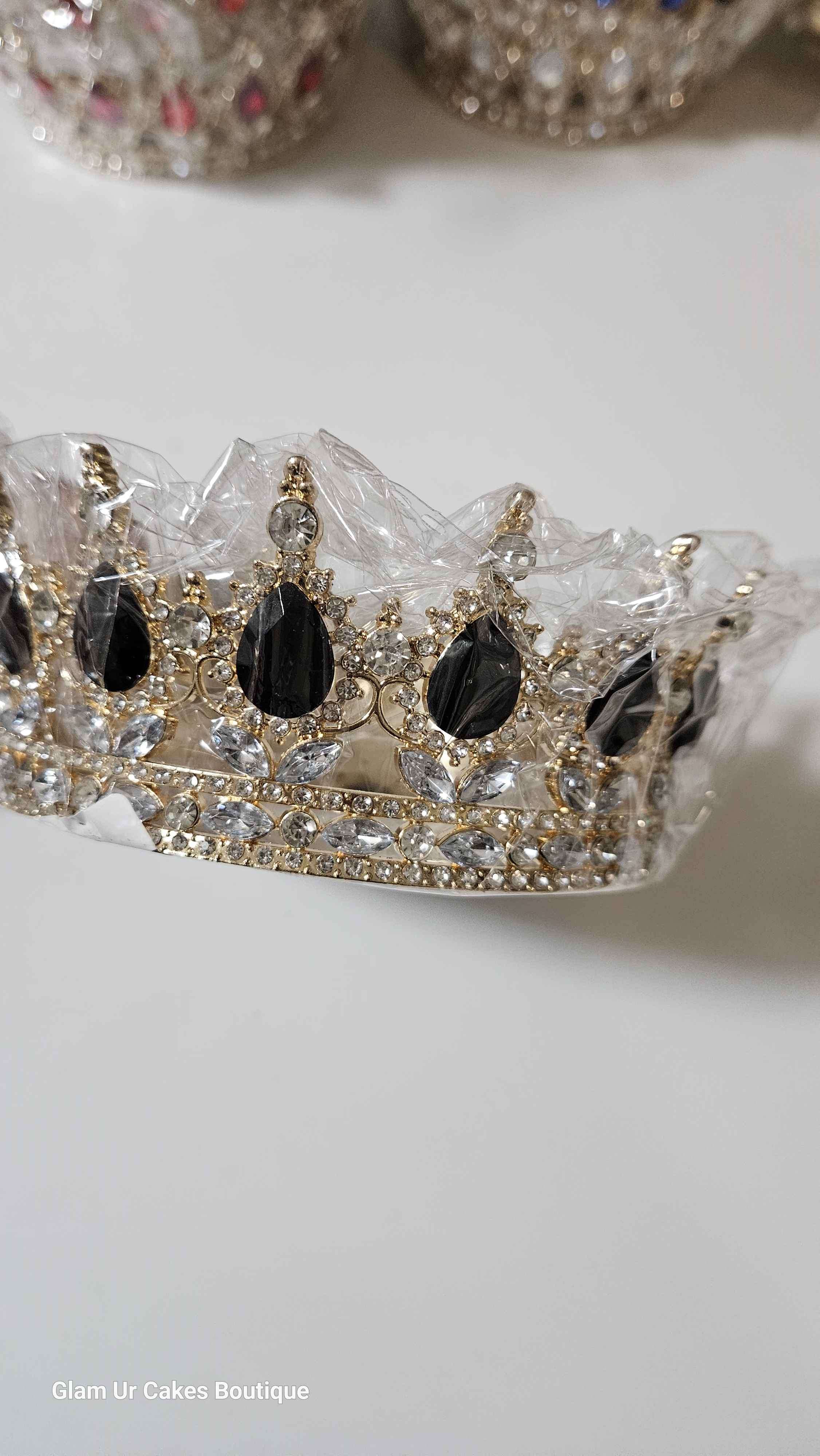 Gold crown with black rine stones
