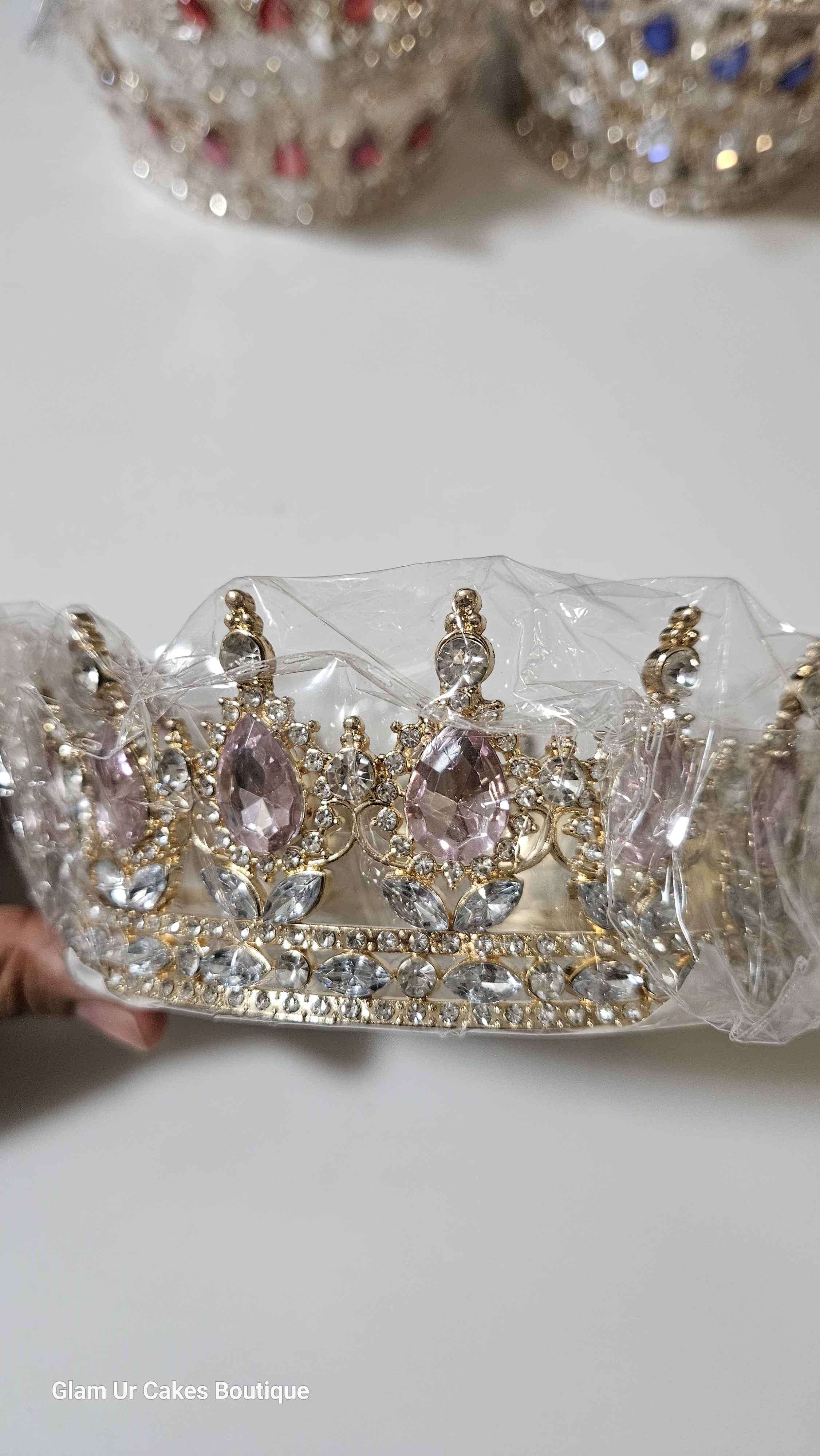 Gold crown with light pink rine stones
