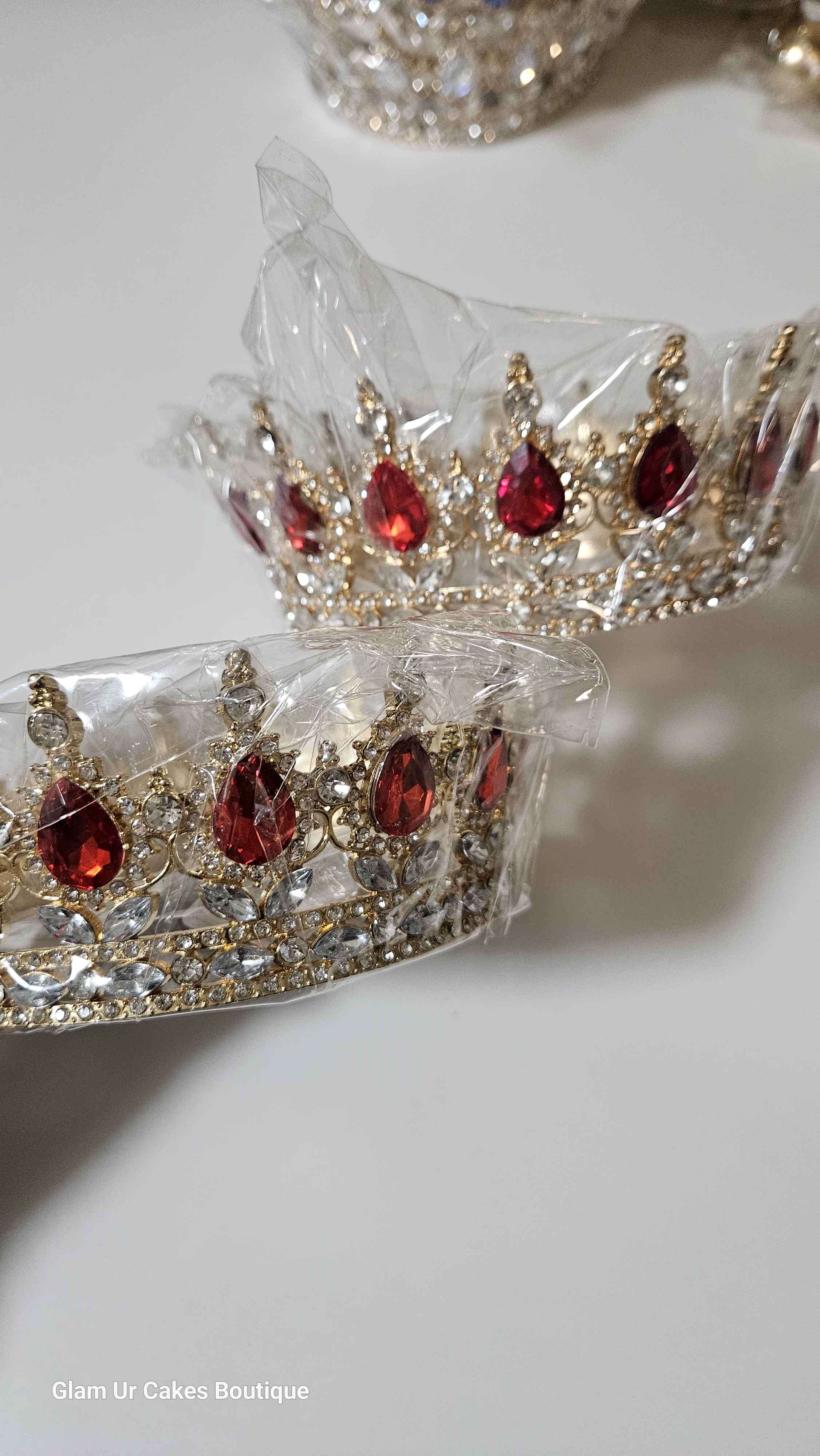 Gold crown with red rine stones