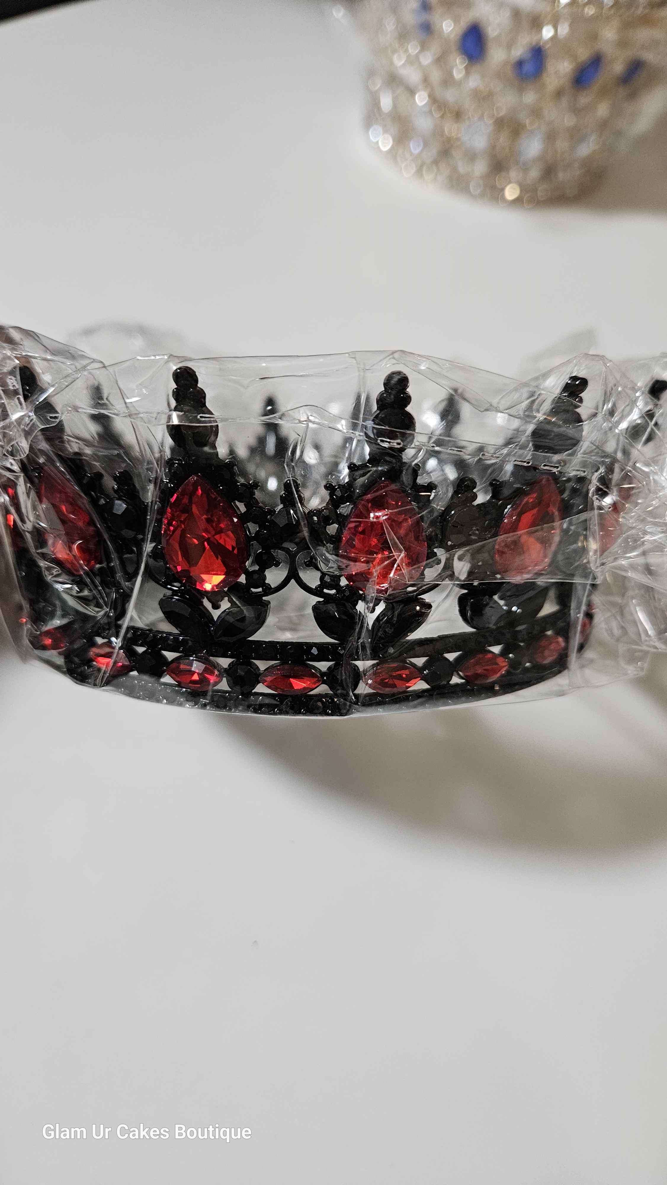 Black crown with red stones